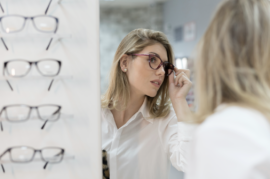 Woman trying on glasses