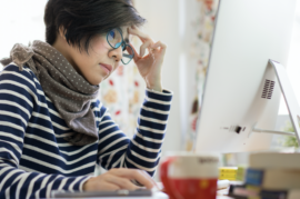 Woman looking at a computer screen