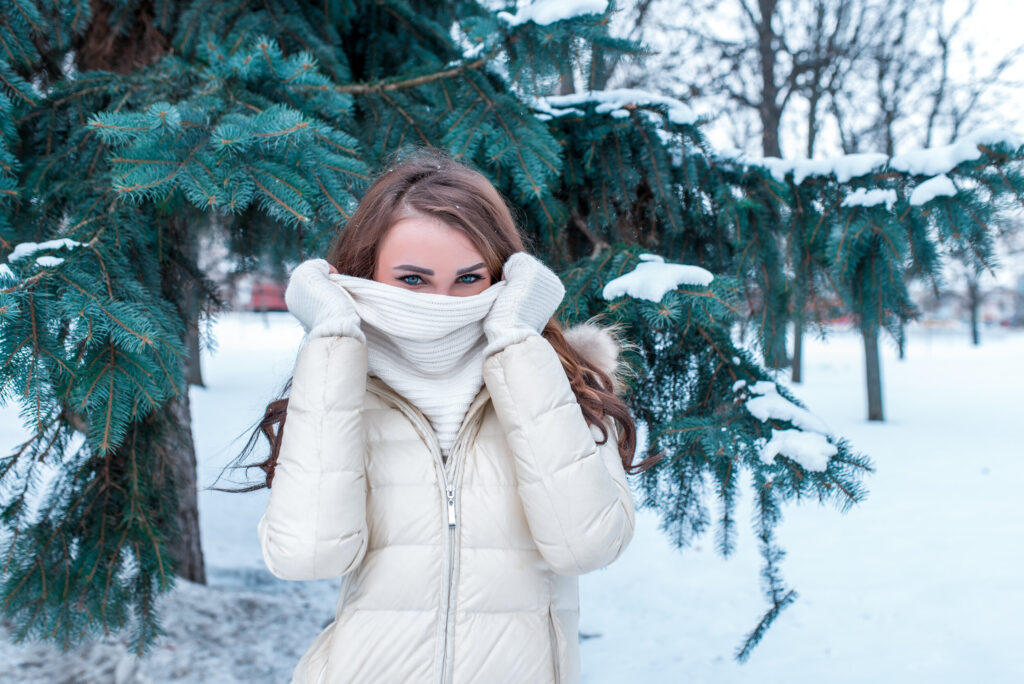 Woman with face covered outside in the wintertime
