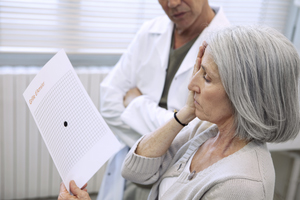 Woman having her eyes examined for macular degeneration