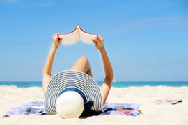 Laying on the beach reading